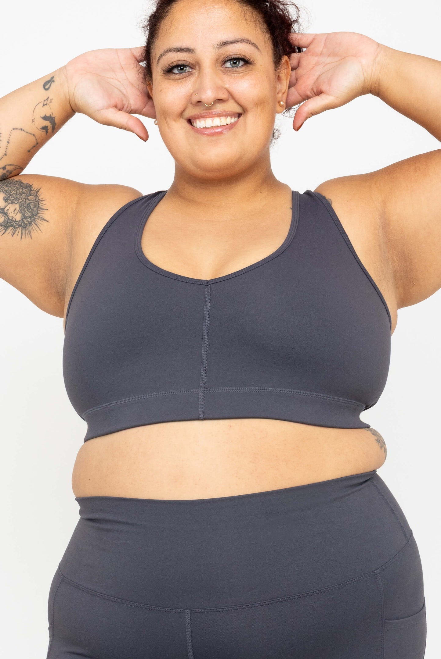 Model with her arms up, wearing Superfit Hero SuperHold™ V-neck Sports Bra in color Carbon, size 2X