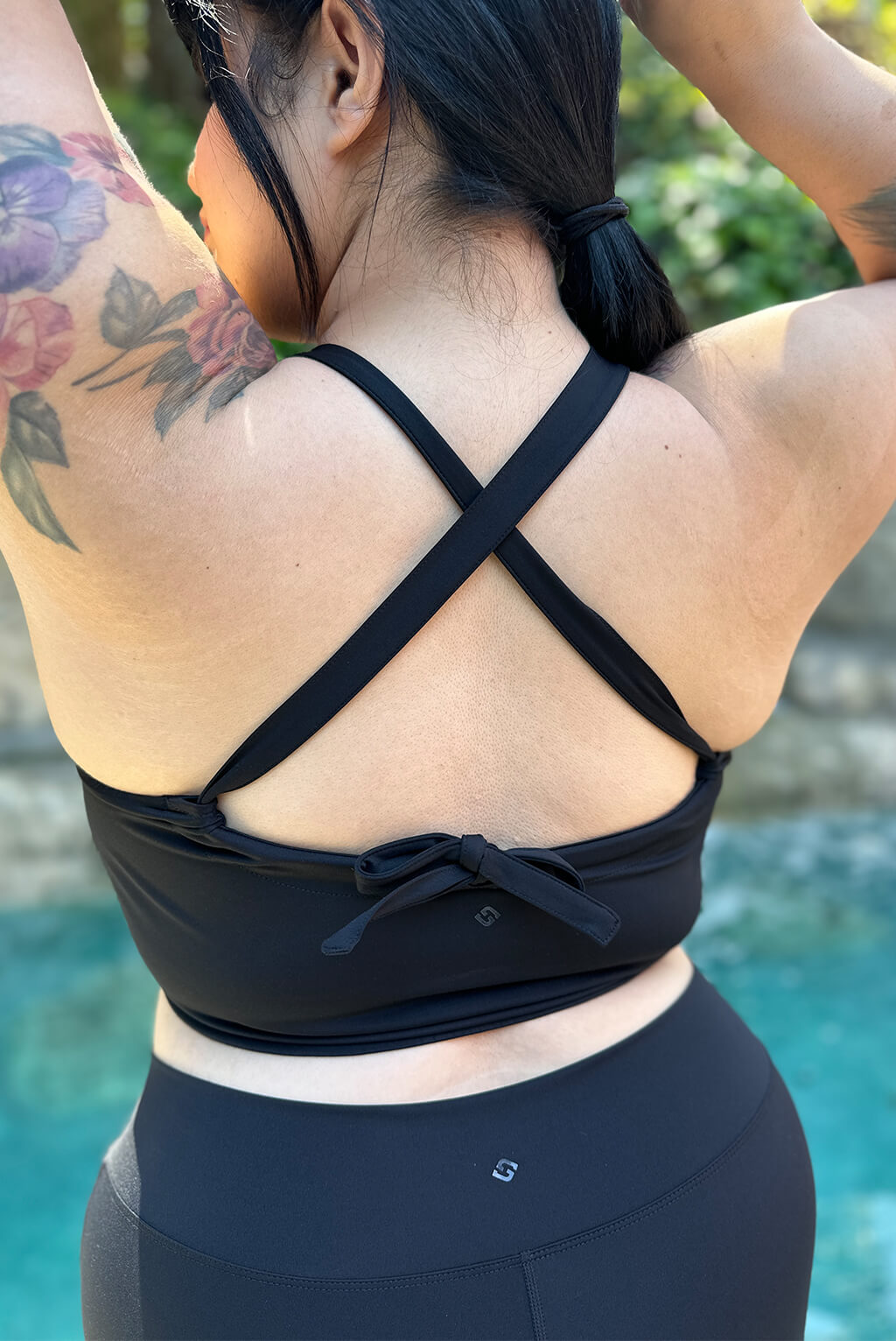 Back view of crossed straps on plus size cinched bikini
