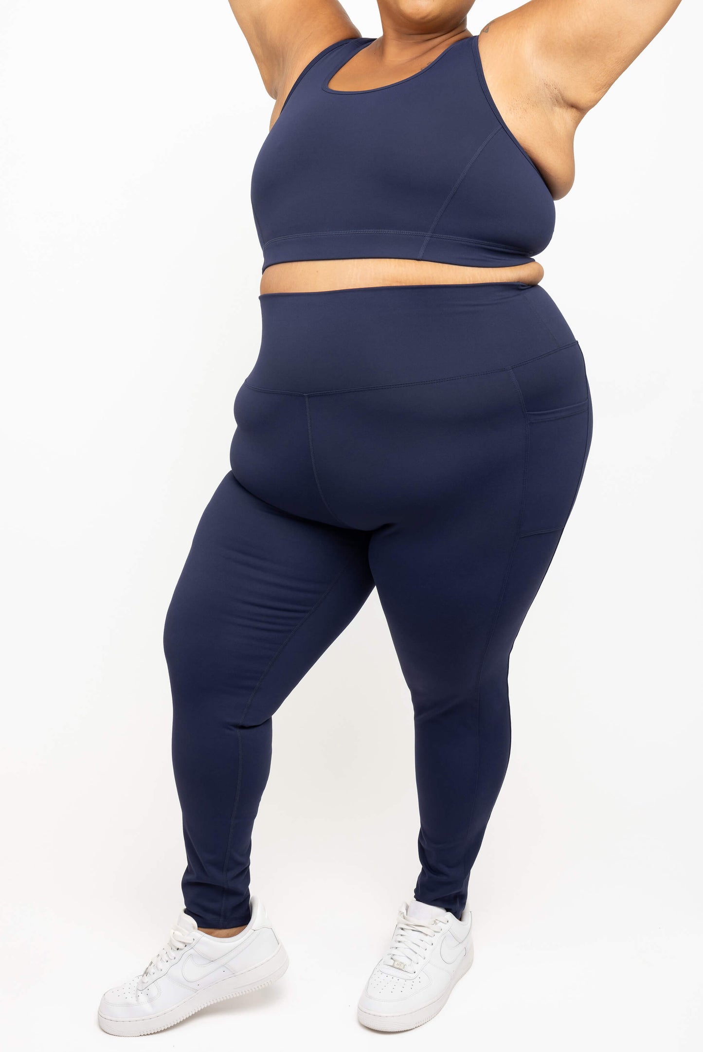 Cropped view of Superfit Hero plus size compression leggings with pockets in navy size 3X