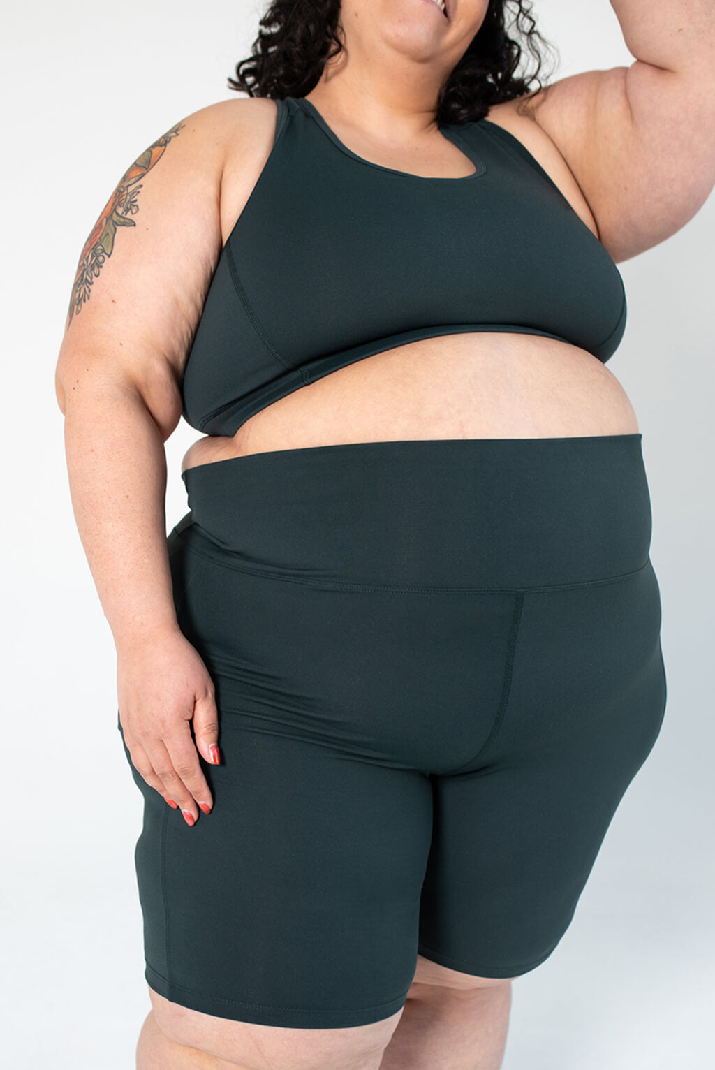 Size 4X model wearing evergreen bike shorts