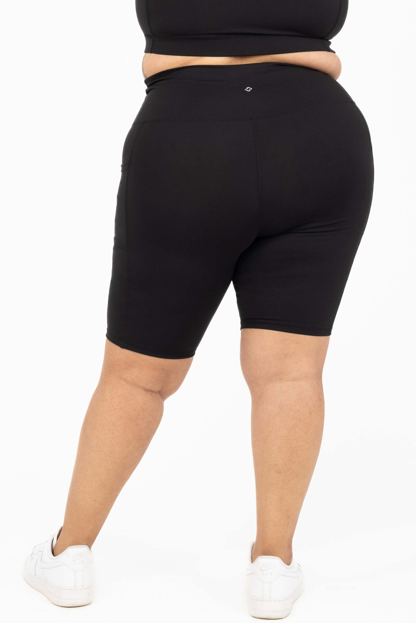 Plus size 11 inch biker shorts with pockets black back view