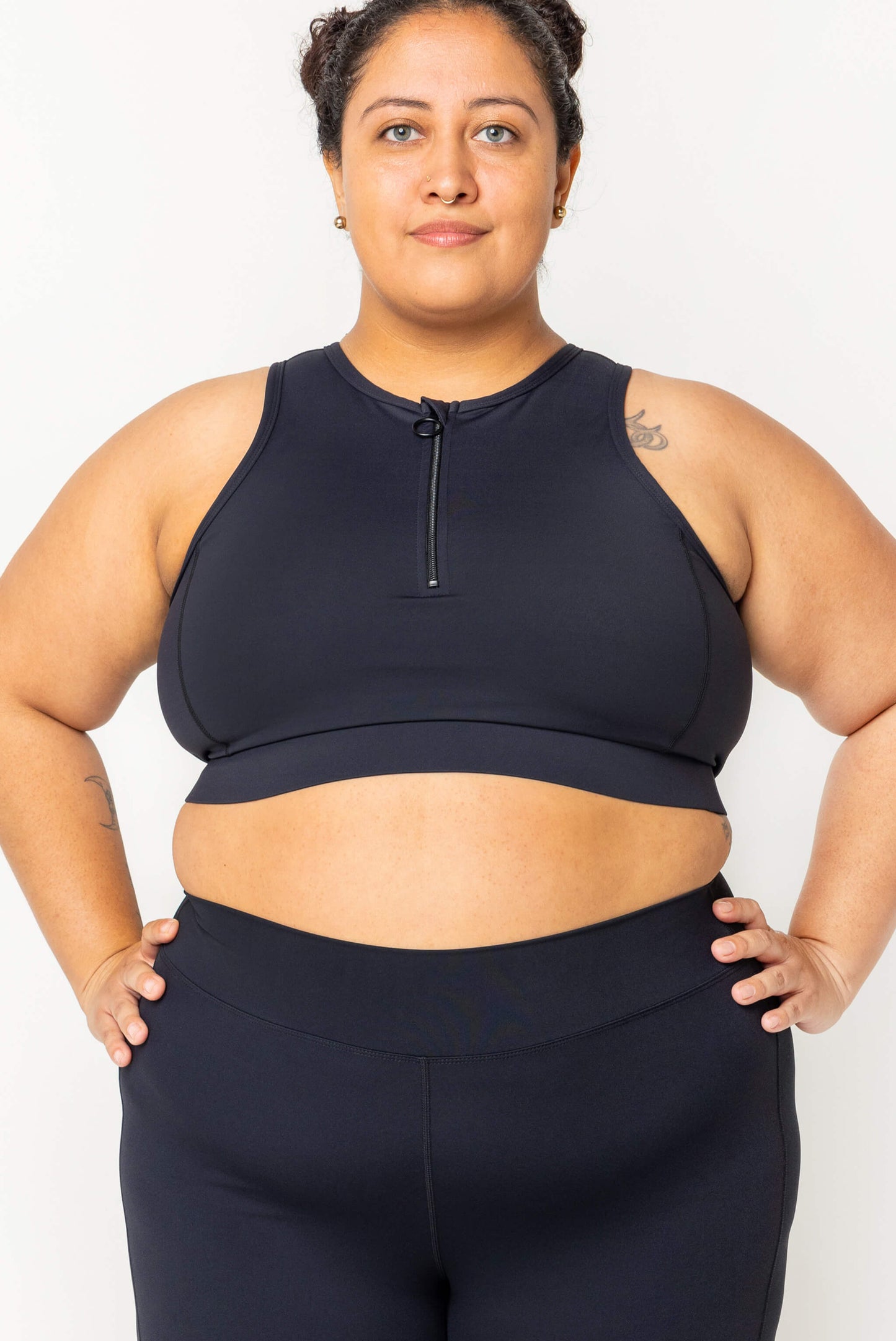 Plus size model wearing half zip crop bikini black size 2X