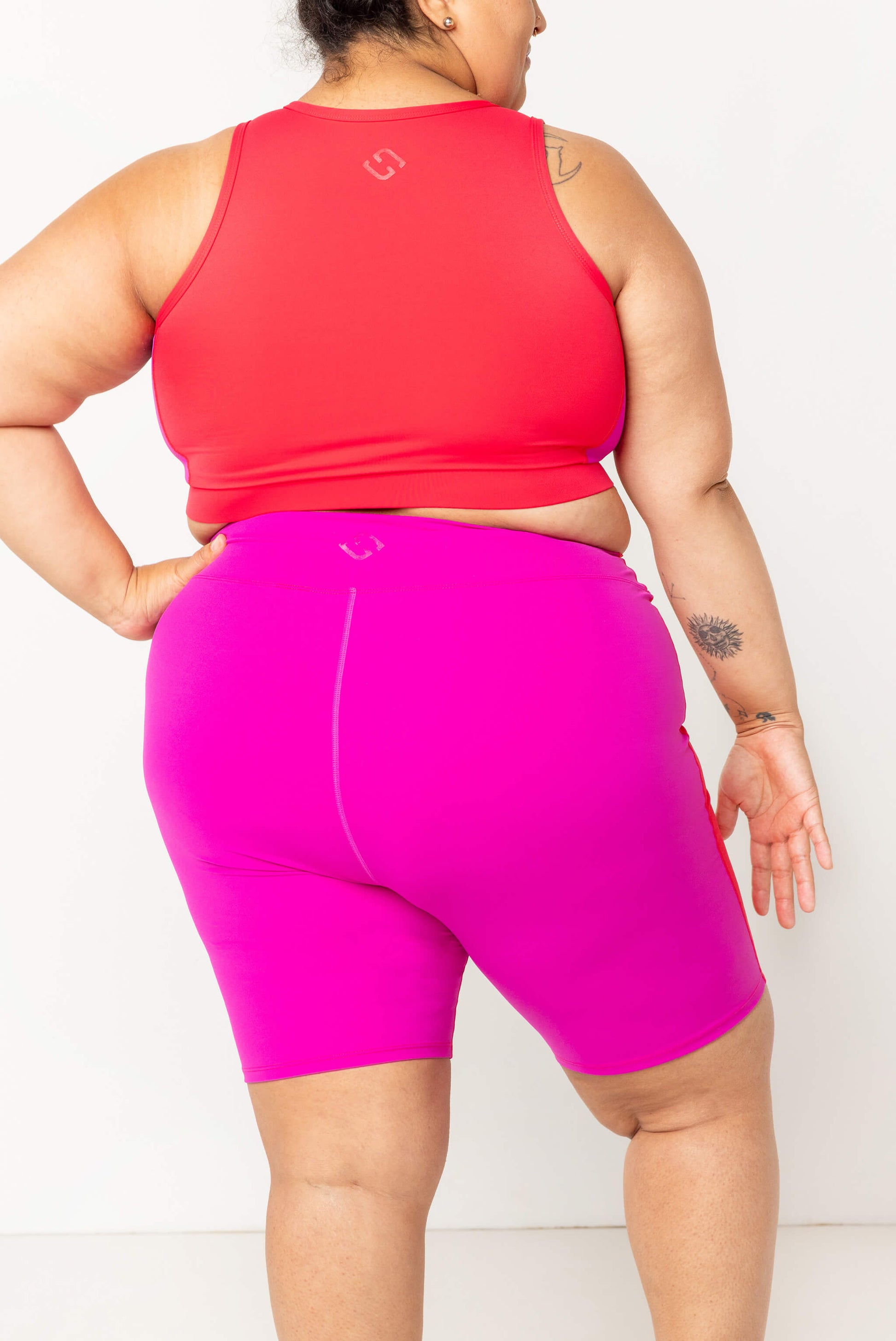 back view of size 2X 9 Inch Swim Shorts - Colorblock Fuchsia