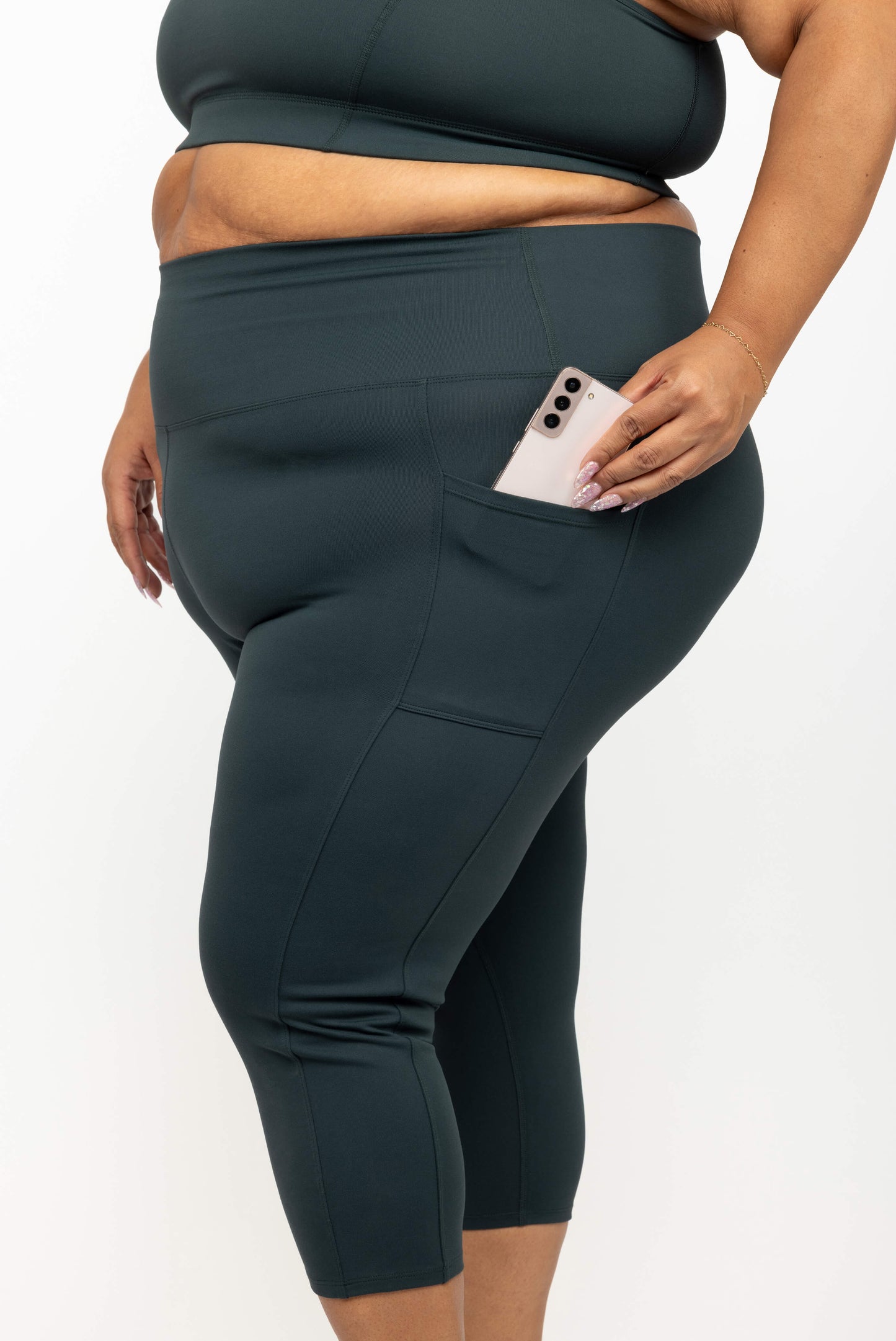 Profile view of Superfit Hero plus size compression activewear capris size 3X color evergreen