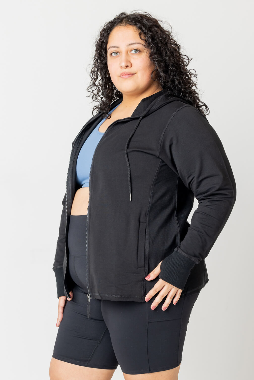 Plus size model wearing Superfit Hero hoodie in size 3X