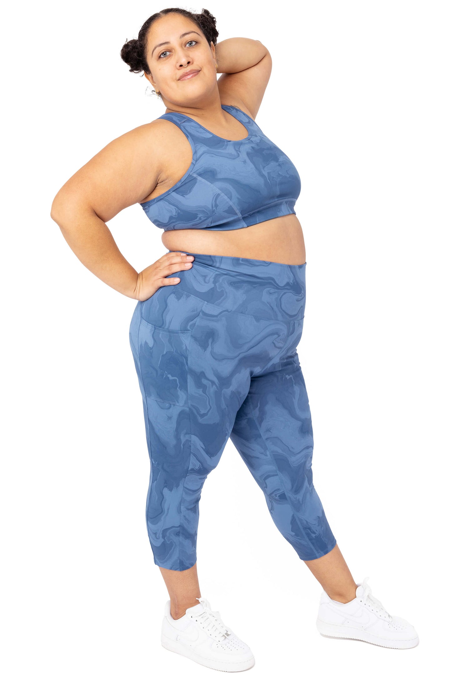 model wearing Plus size SuperHold capris with pockets in moonlight marble print size 2X