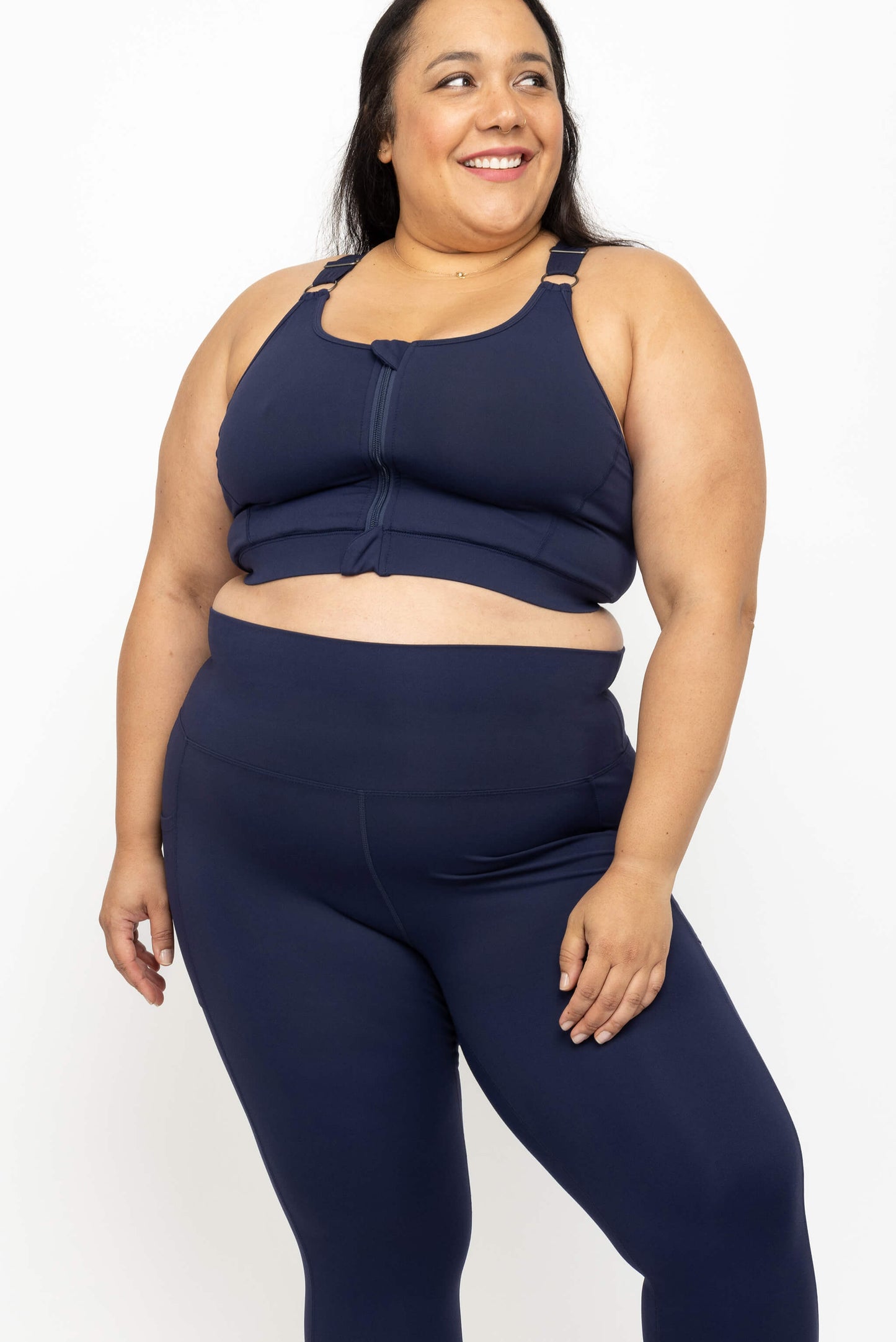 Model posing in best fitting plus size sports bra Superfit Hero plus size zip front sports bra, navy, size 2X