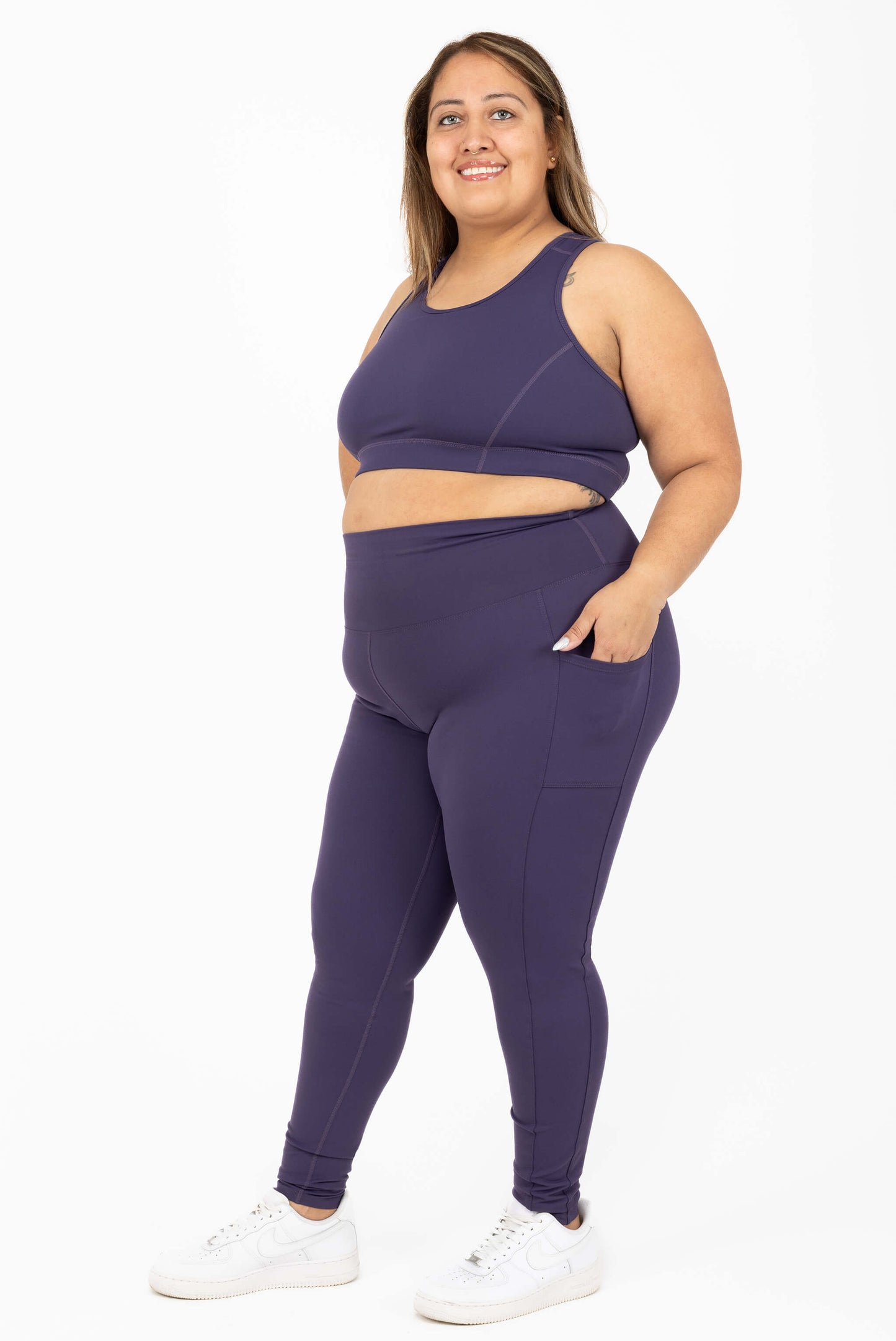 Plus size compression leggings purple side view size 2X, hand in pocket