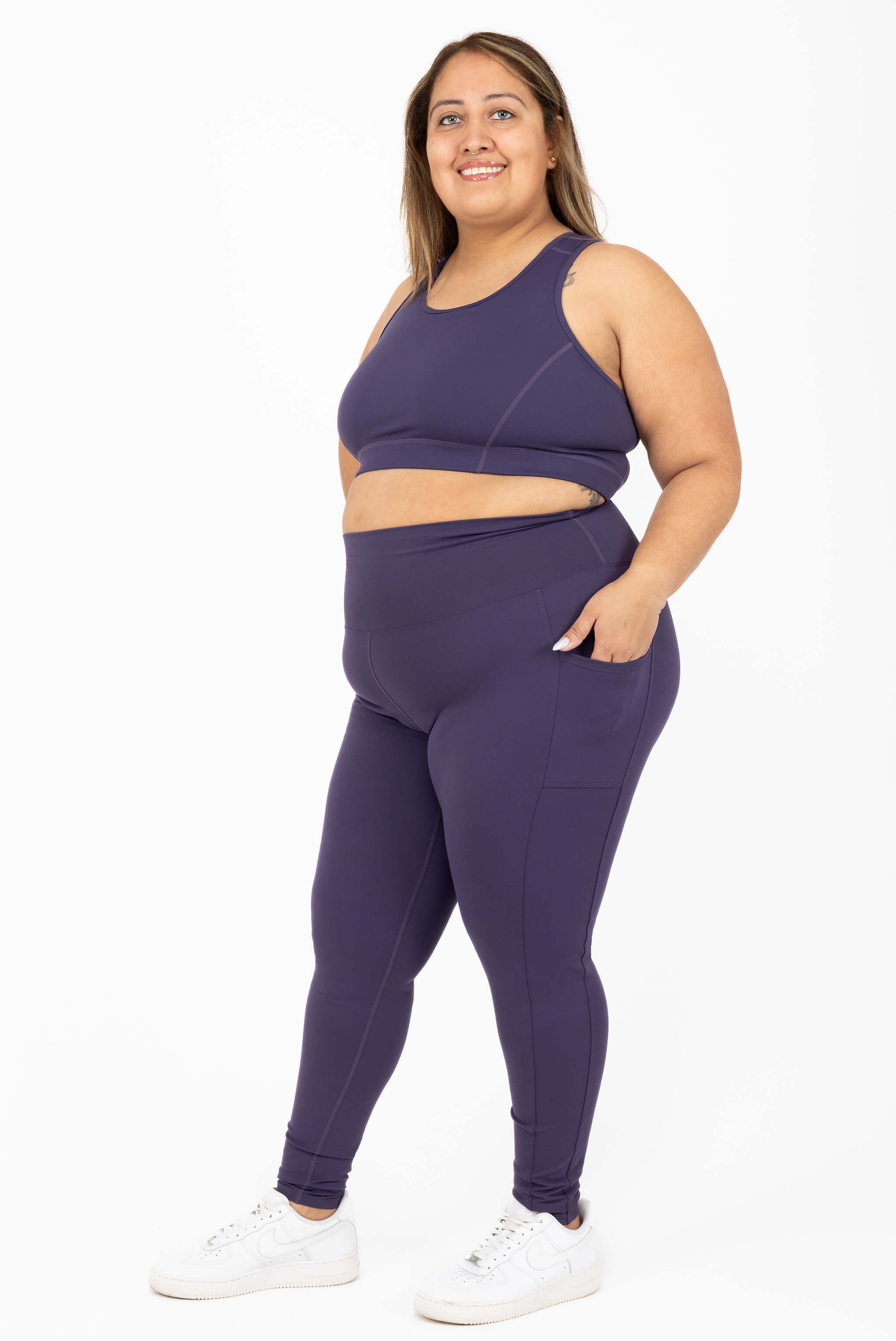 Plus size compression leggings purple side view size 2X, hand in pocket
