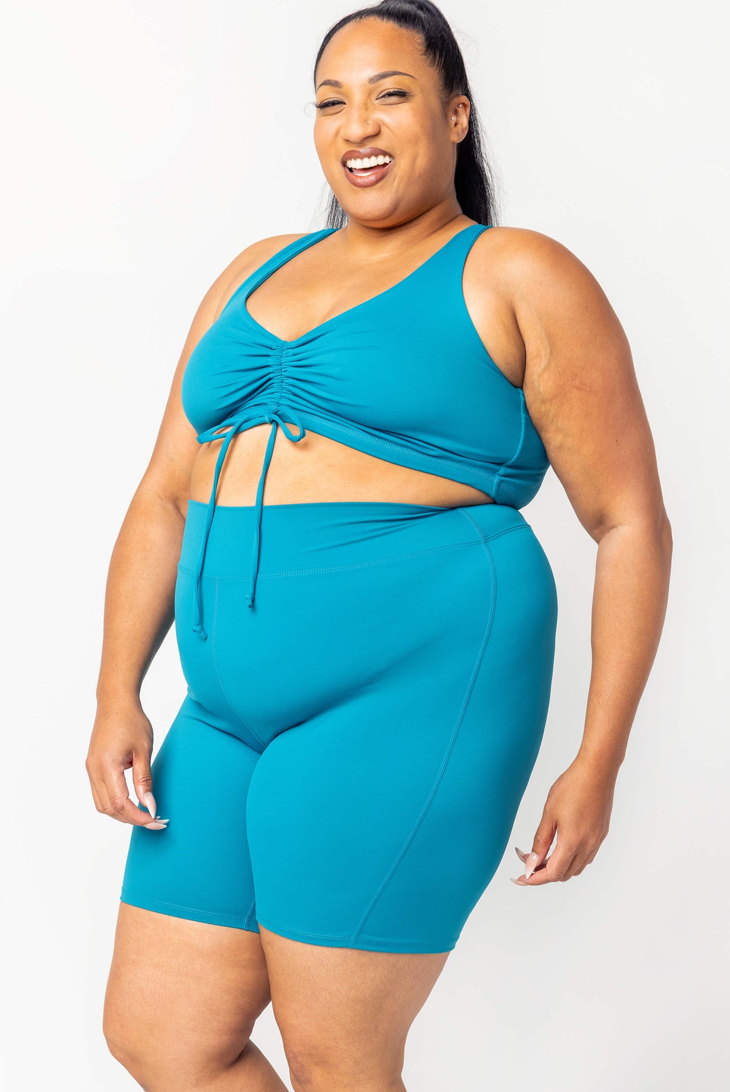 profile view of teal plus size 9 inch swim shorts