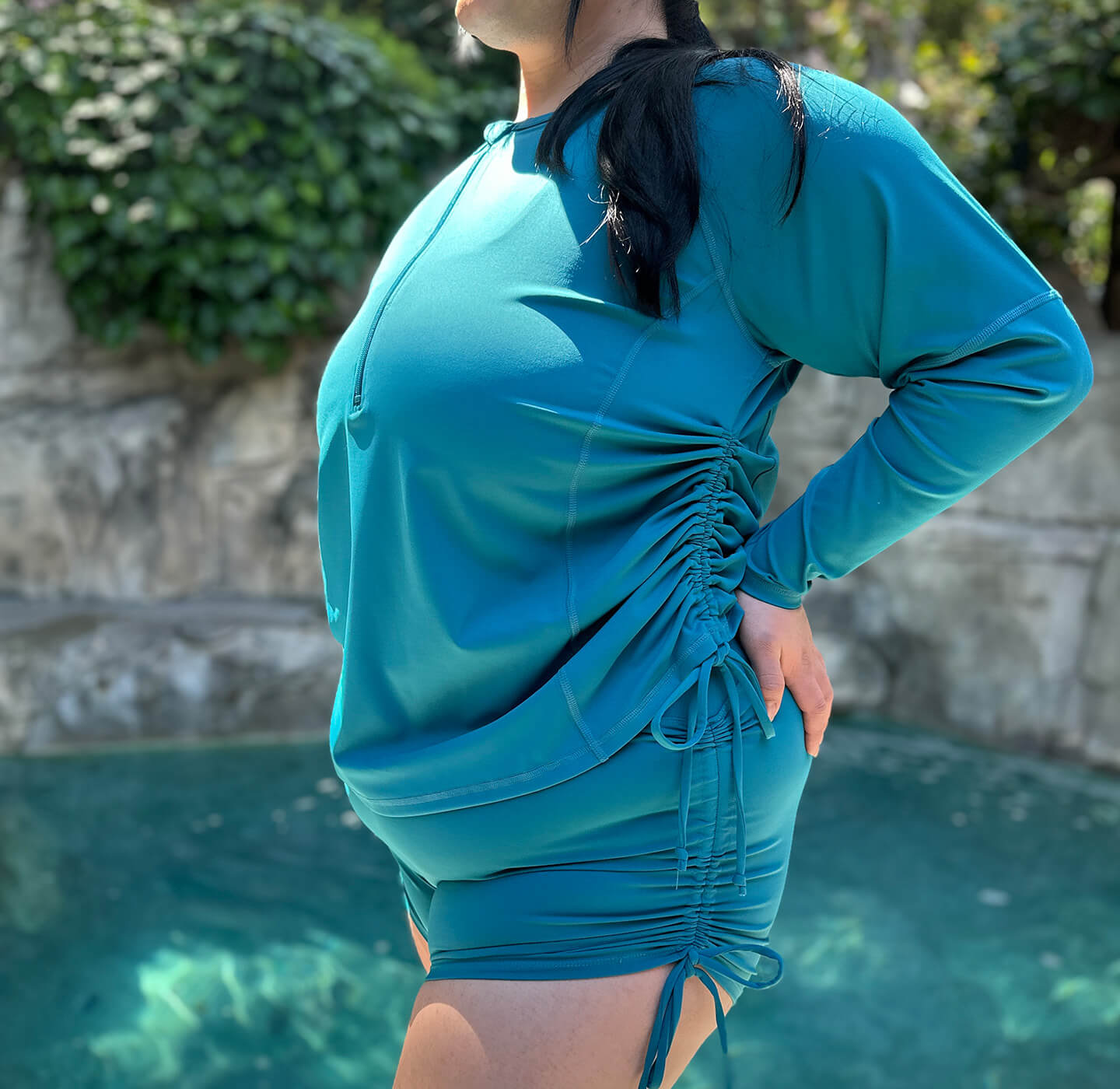 Plus size swim rash guard and booty shorts with matching side cinch detail