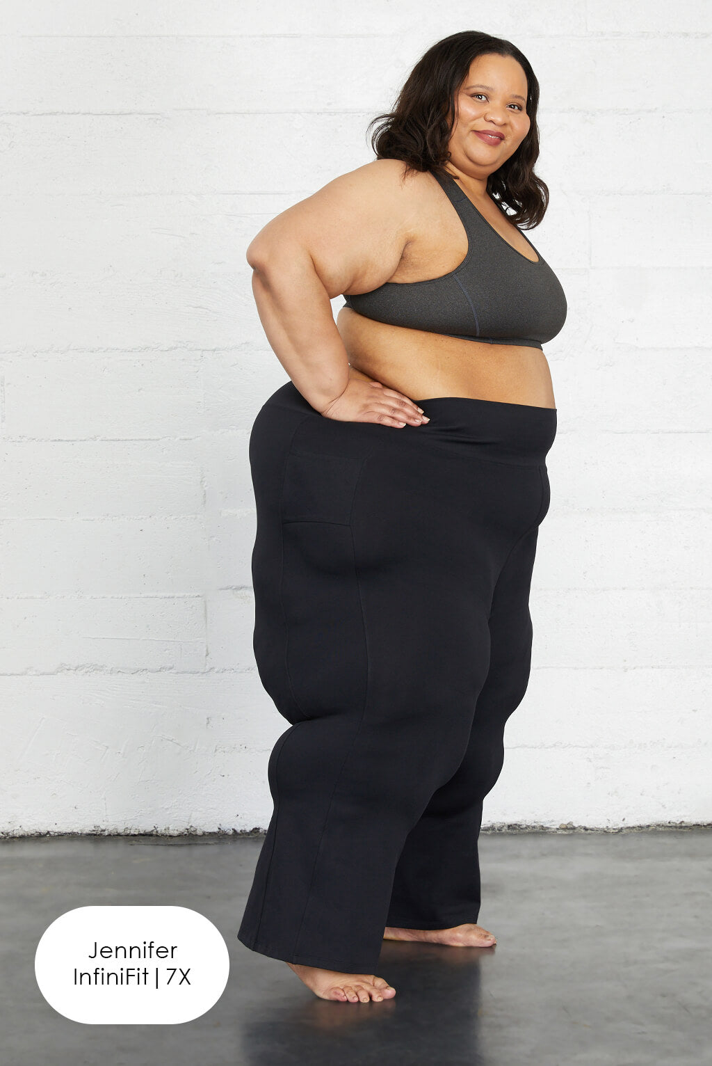 Model wearing Superfit Hero black plus size flare leggings with pockets size 7X