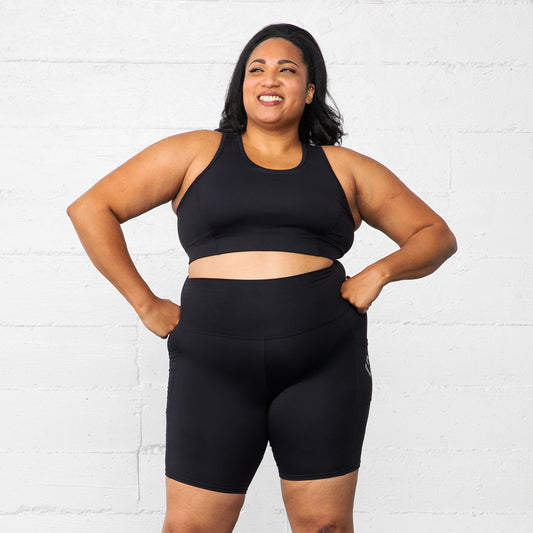 Plus size women wearing Superfit Hero Superhold Pocket Bike shorts Black.