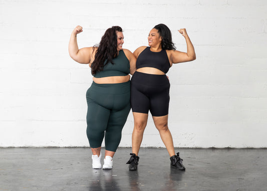 Two plus size women wearing Superfit Hero Superhold Leggings Bike Shorts and Bra.