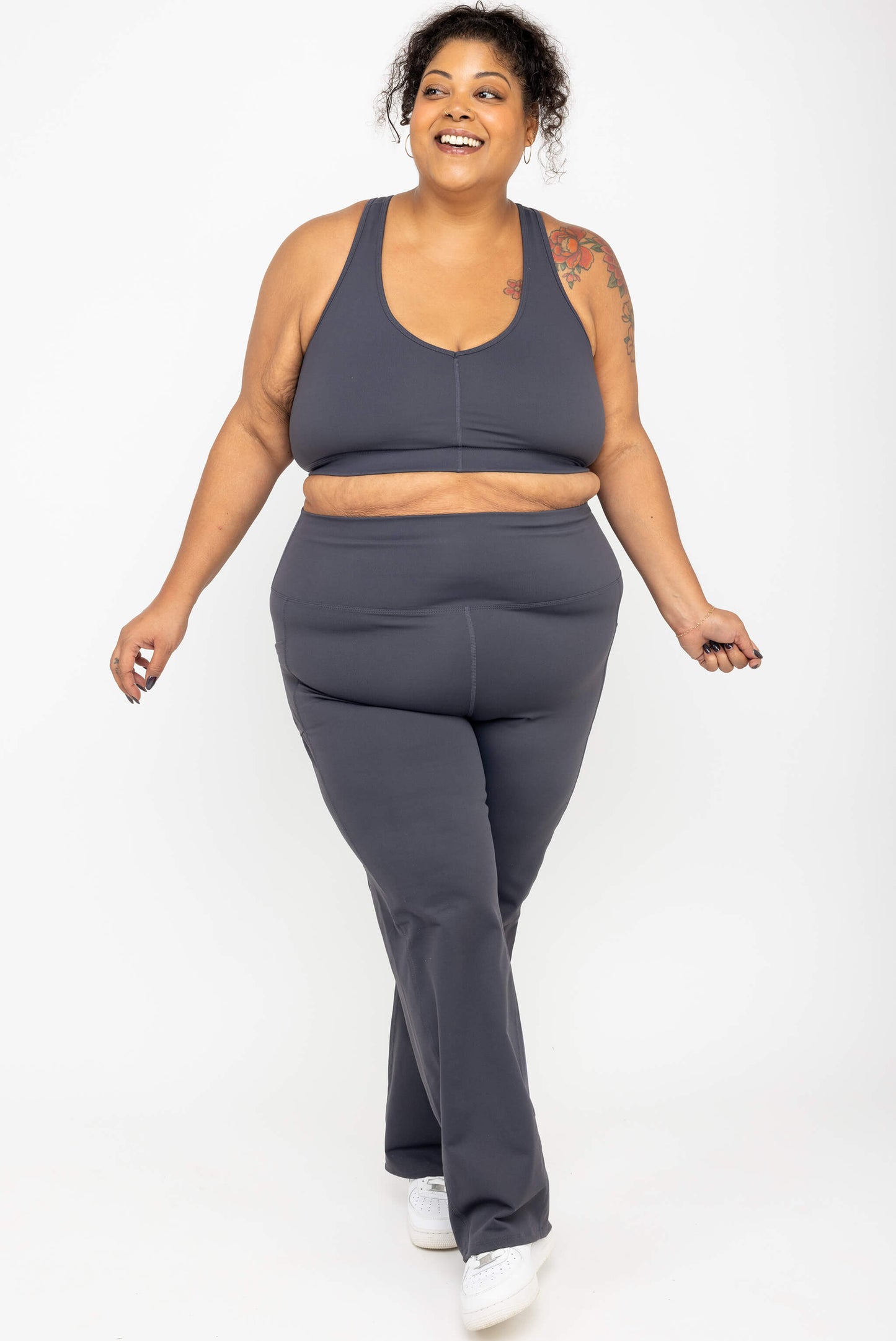 Smiling model wearing Superfit Hero SuperHold™ Straight Leggings in color Carbon, size 3X