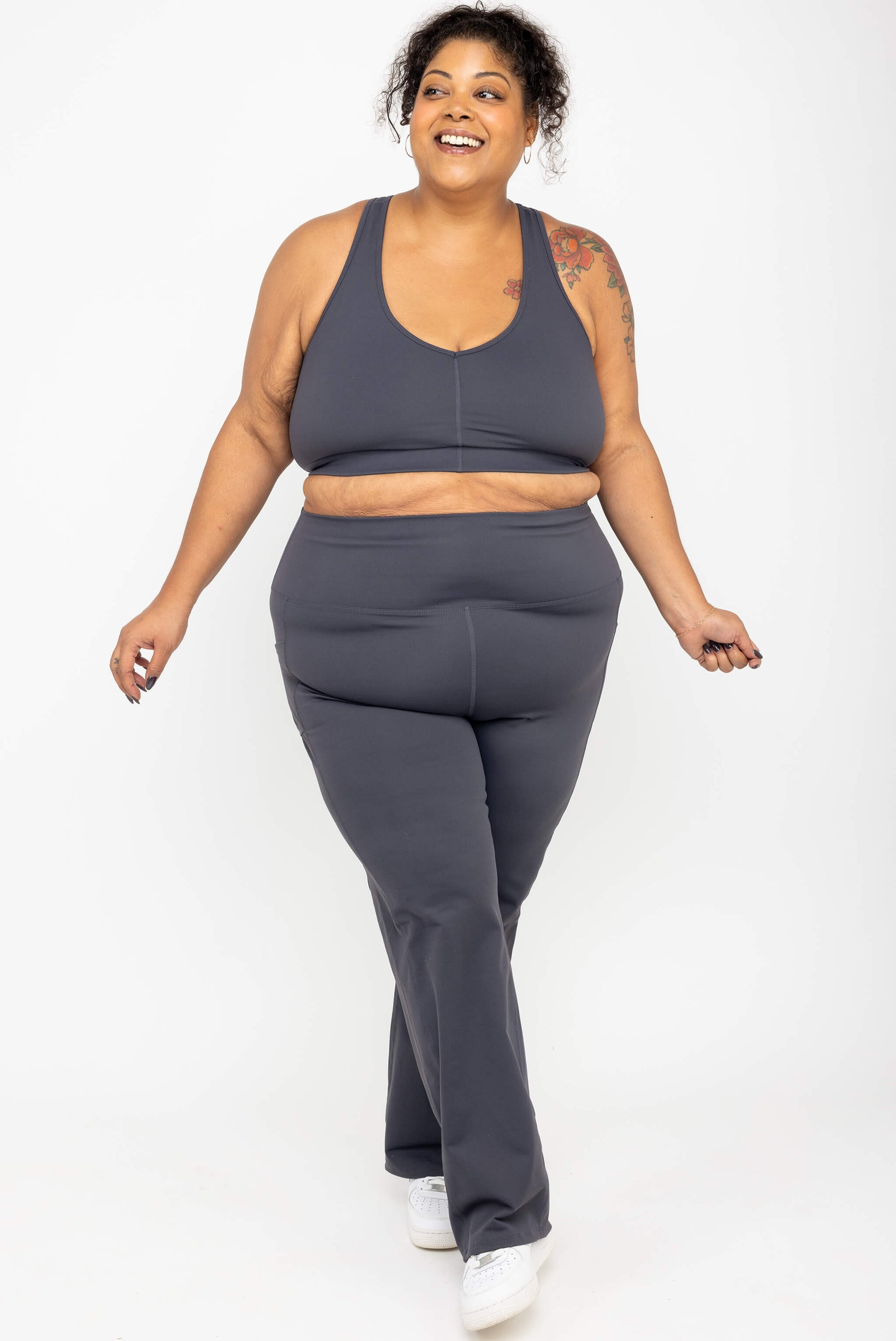 Smiling model wearing Superfit Hero SuperHold™ Straight Leggings in color Carbon, size 3X