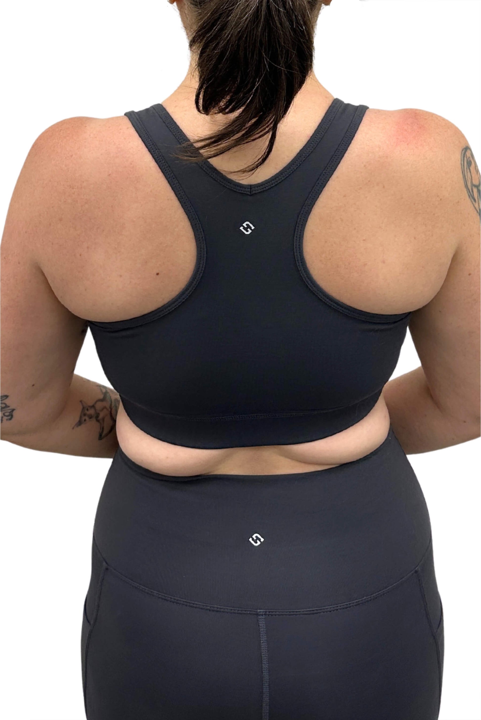 Back view of model wearing Superfit Hero V-Neck Sports bra in size Large, color Carbon