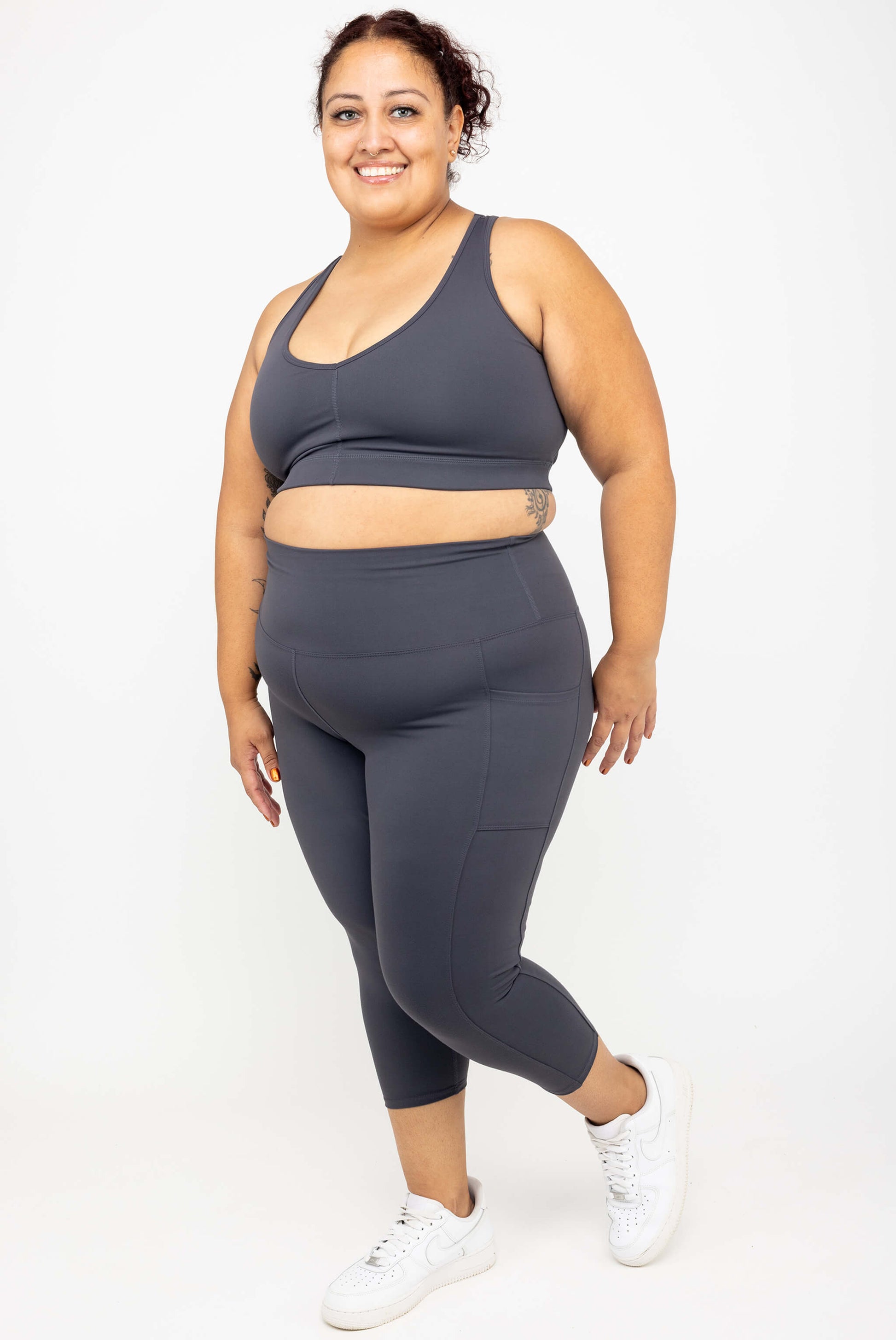 Happy model wearing Superfit Hero SuperHold™ Pocket Capris, color Carbon, size 2X