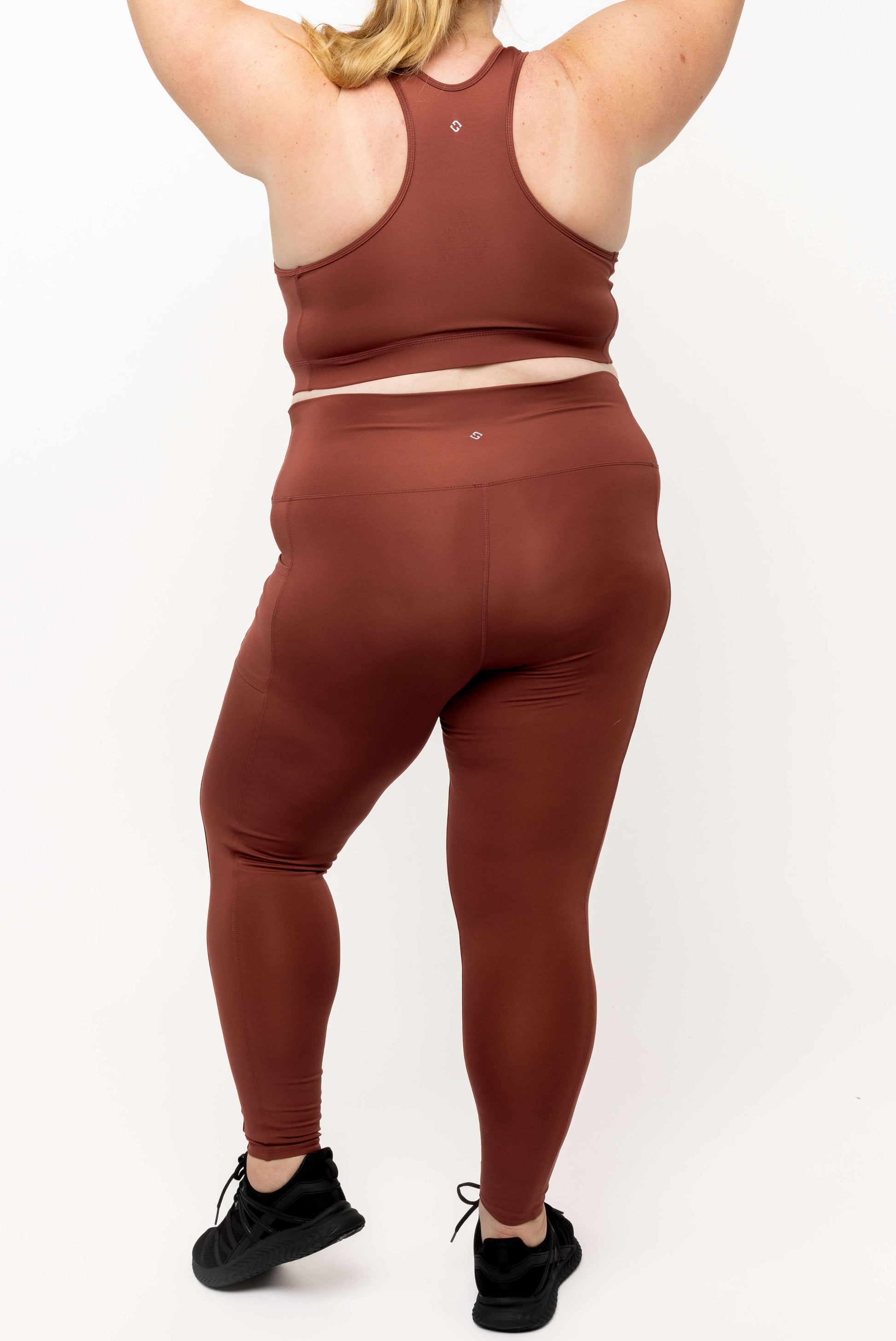 Back view of model wearing Cinnamon SuperCool leggings size 2X