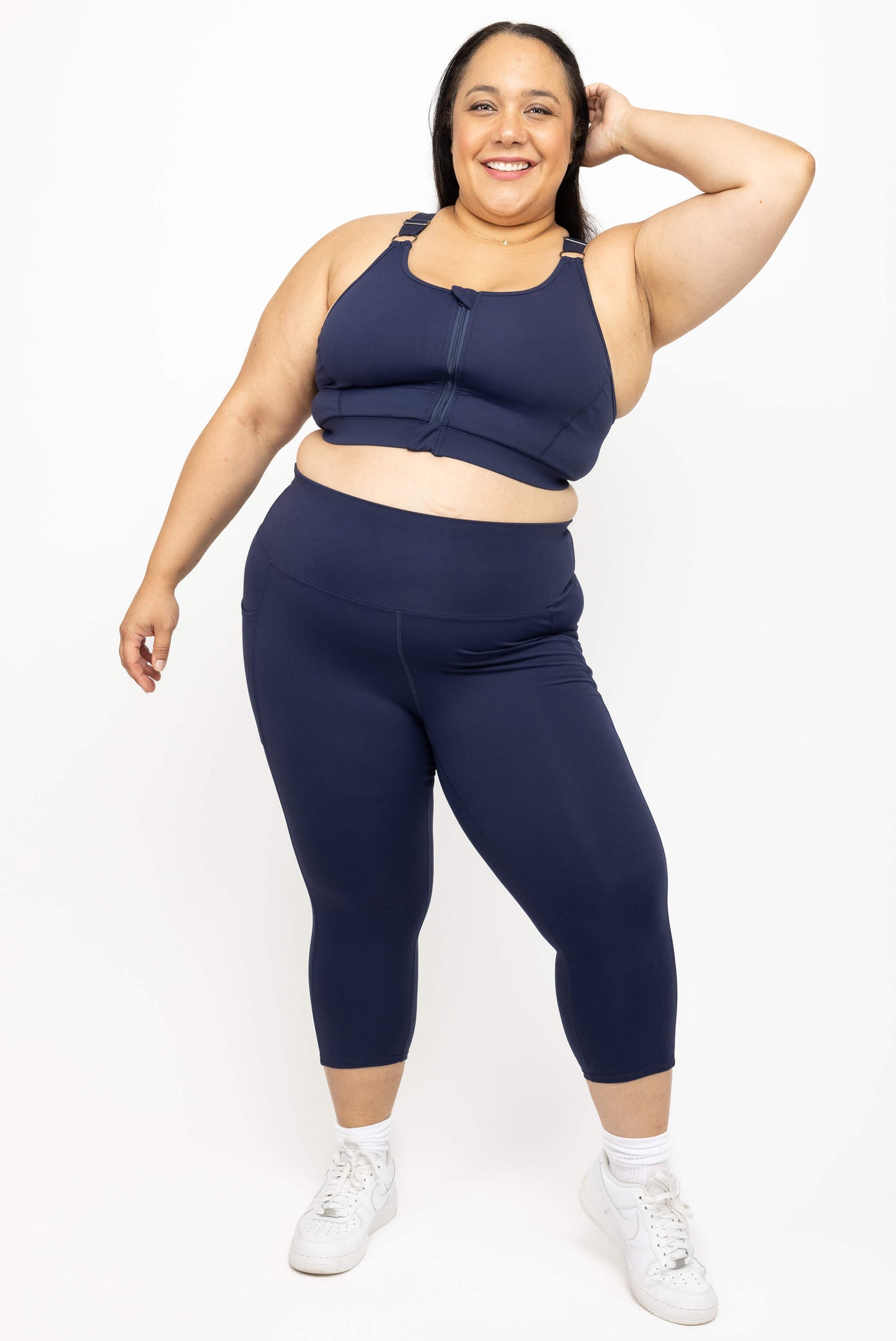 Model smiling in size 2X compression capris with pockets from Superfit Hero