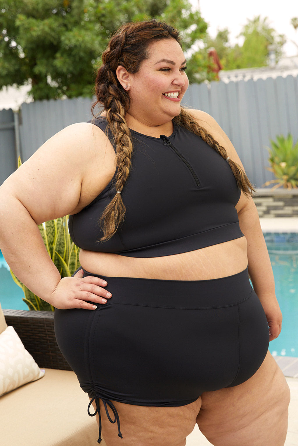 Side view of plus size swim booty shorts with ties on the sides.