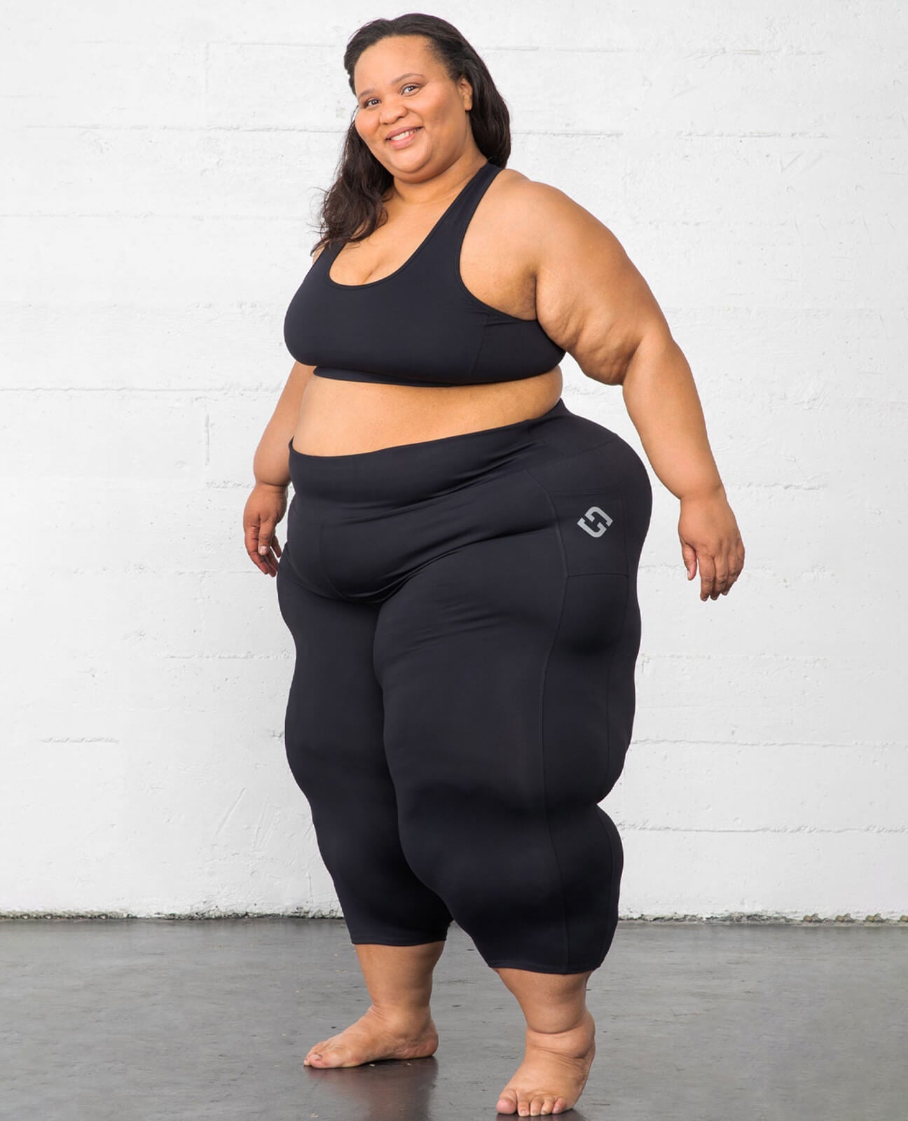 Plus size model wearing compression leggings for lipedema in size 7X