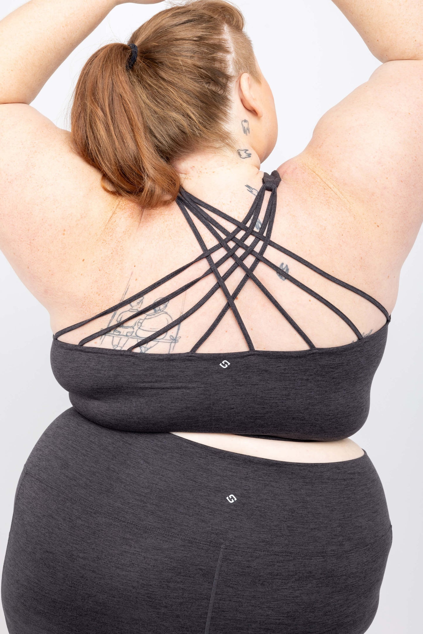 Back view of size 5x plus size bra with strappy back