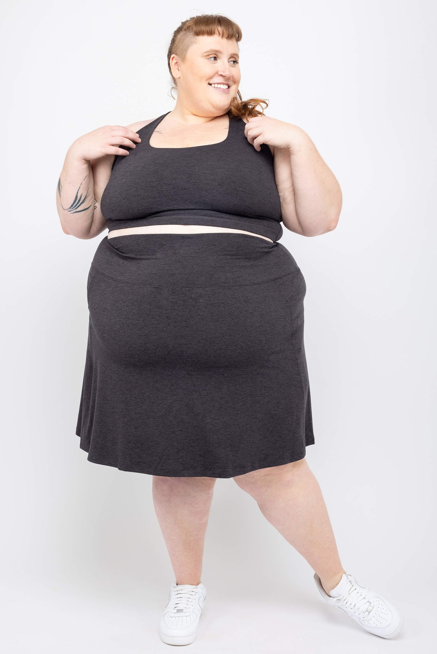 Plus size model wearing SuperSoft skort and matching strappy bra in size 5X