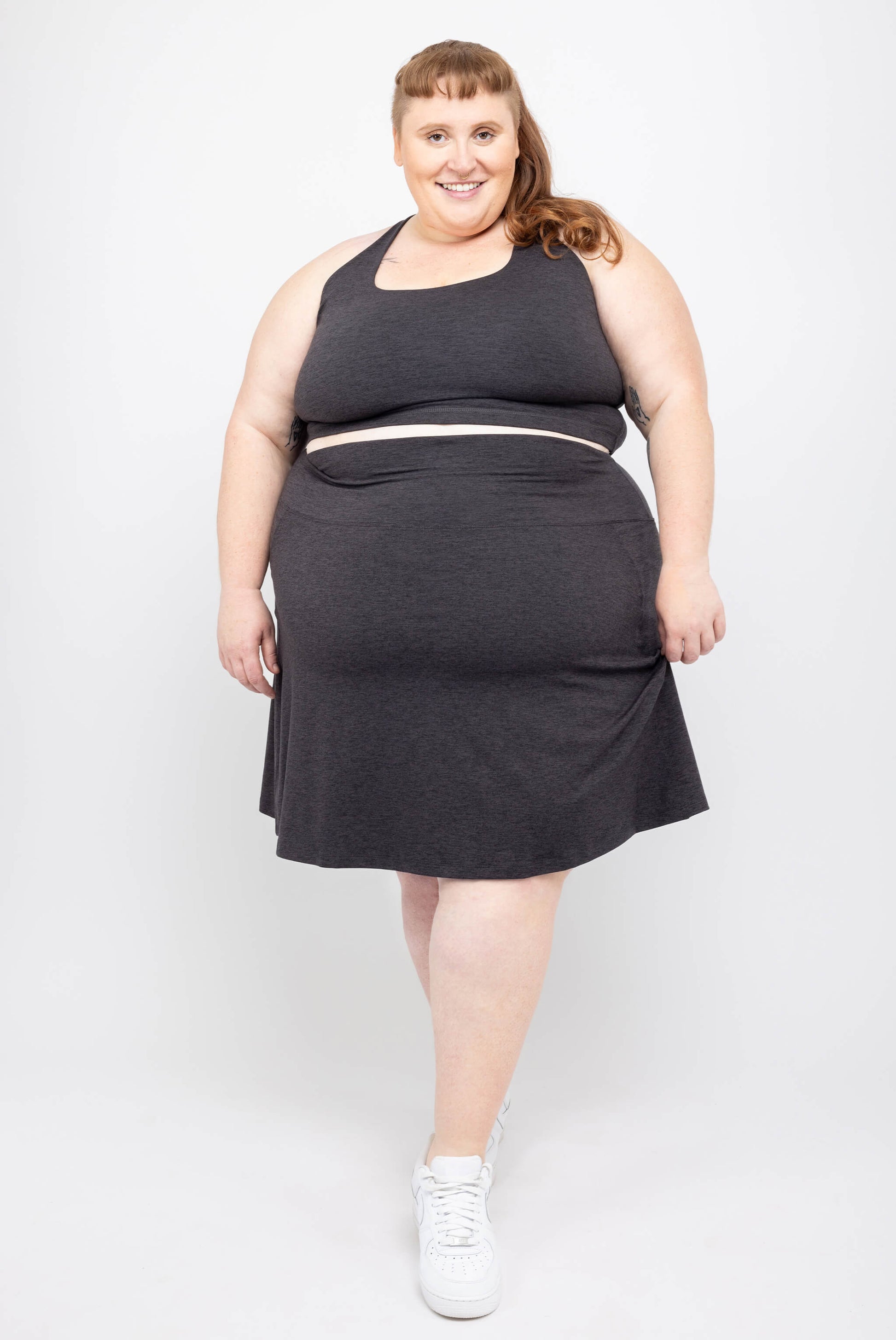 Plus size model wearing Superfit Hero skort with pockets in size 5X