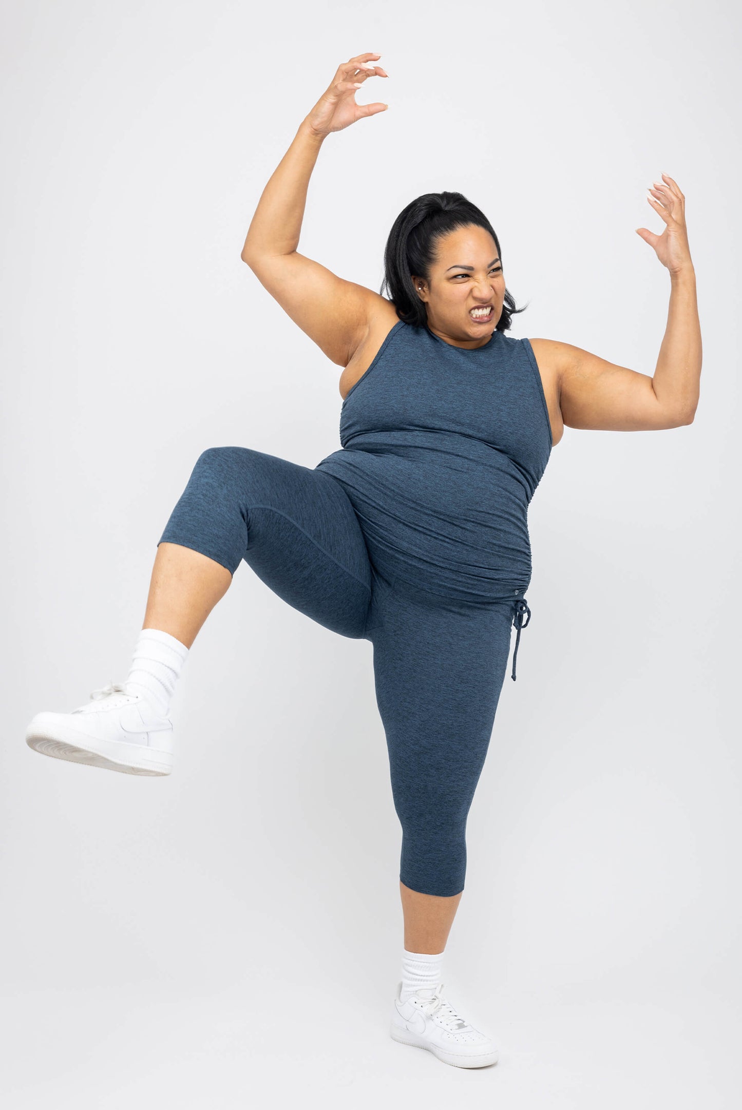 Model making a funny face wearing Superfit Hero Plus Size SuperSoft Cinch Tank Size 2X Heather Navy