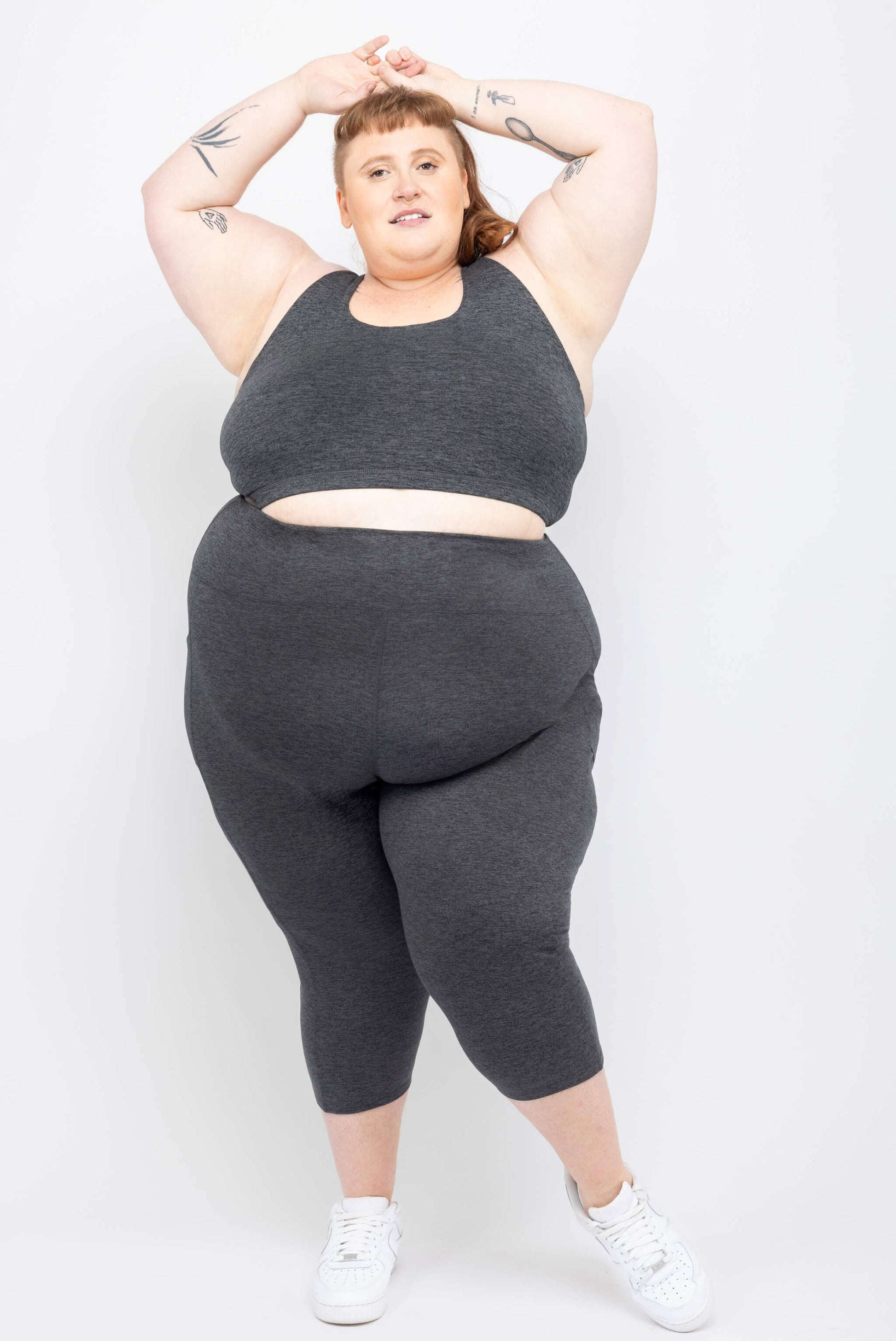 Plus size model poses in Superfit Hero supersoft capris with pockets