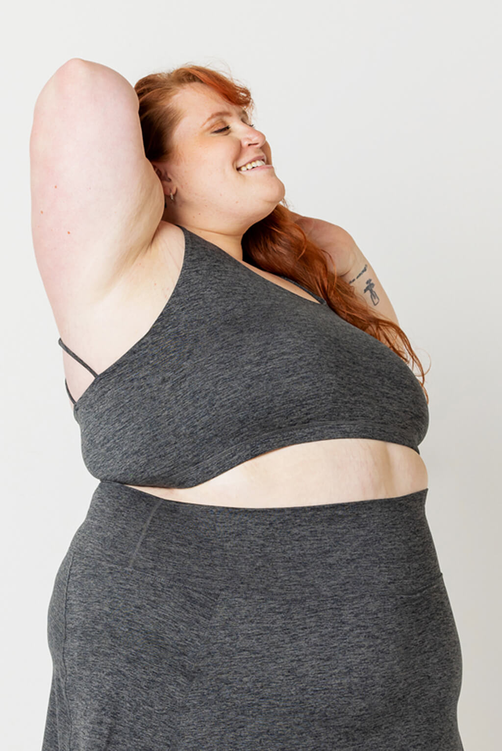 Side view of Plus size model wearing Superfit Hero SuperSoft Strappy Bra in Heather Gray