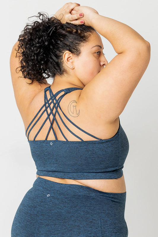 Back profile view of size 2X model wearing Superfit Hero SuperSoft Strappy bra in Heather Navy