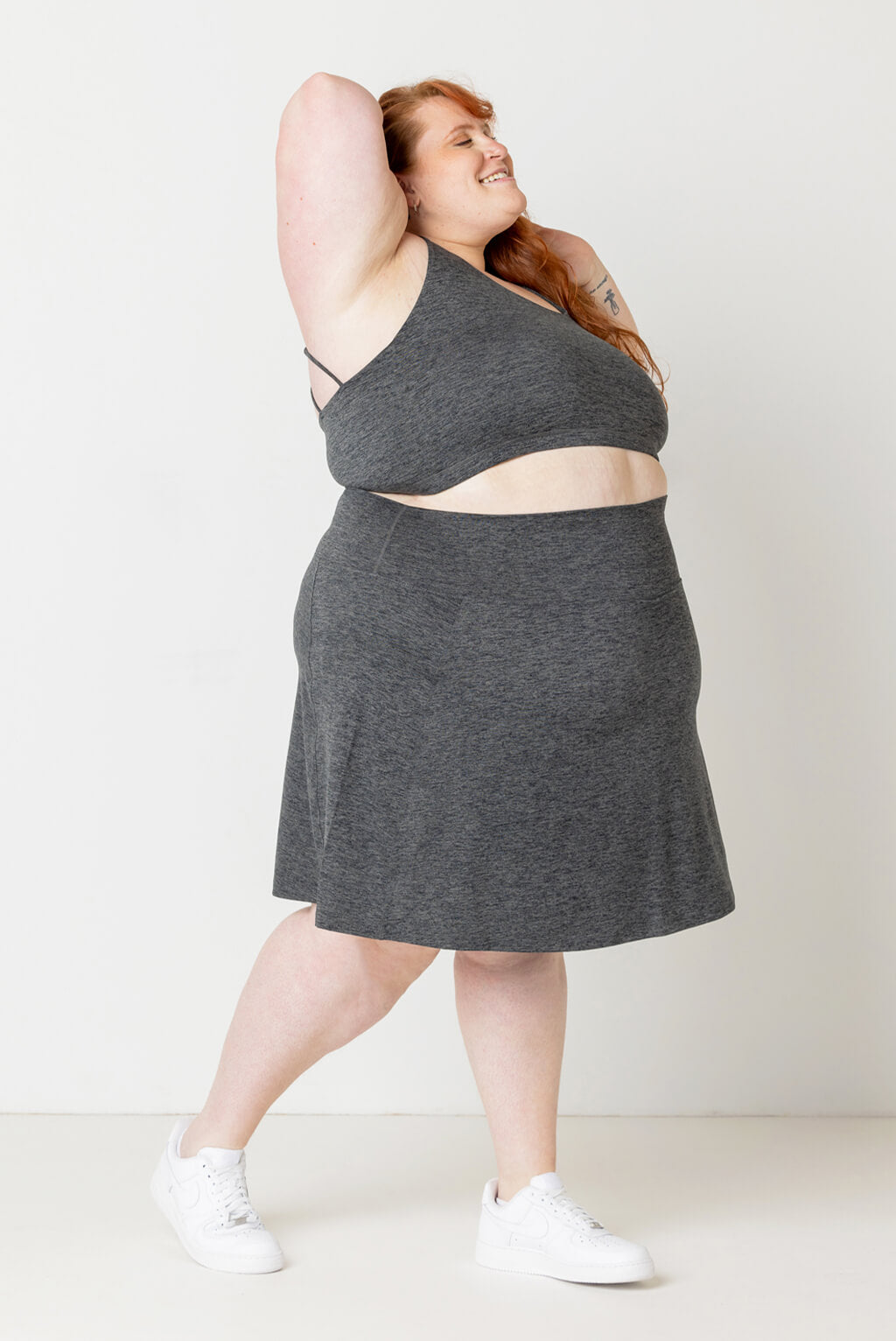 Size 5X model shows off profile of Superfit Hero SuperSoft Skort Heather Gray