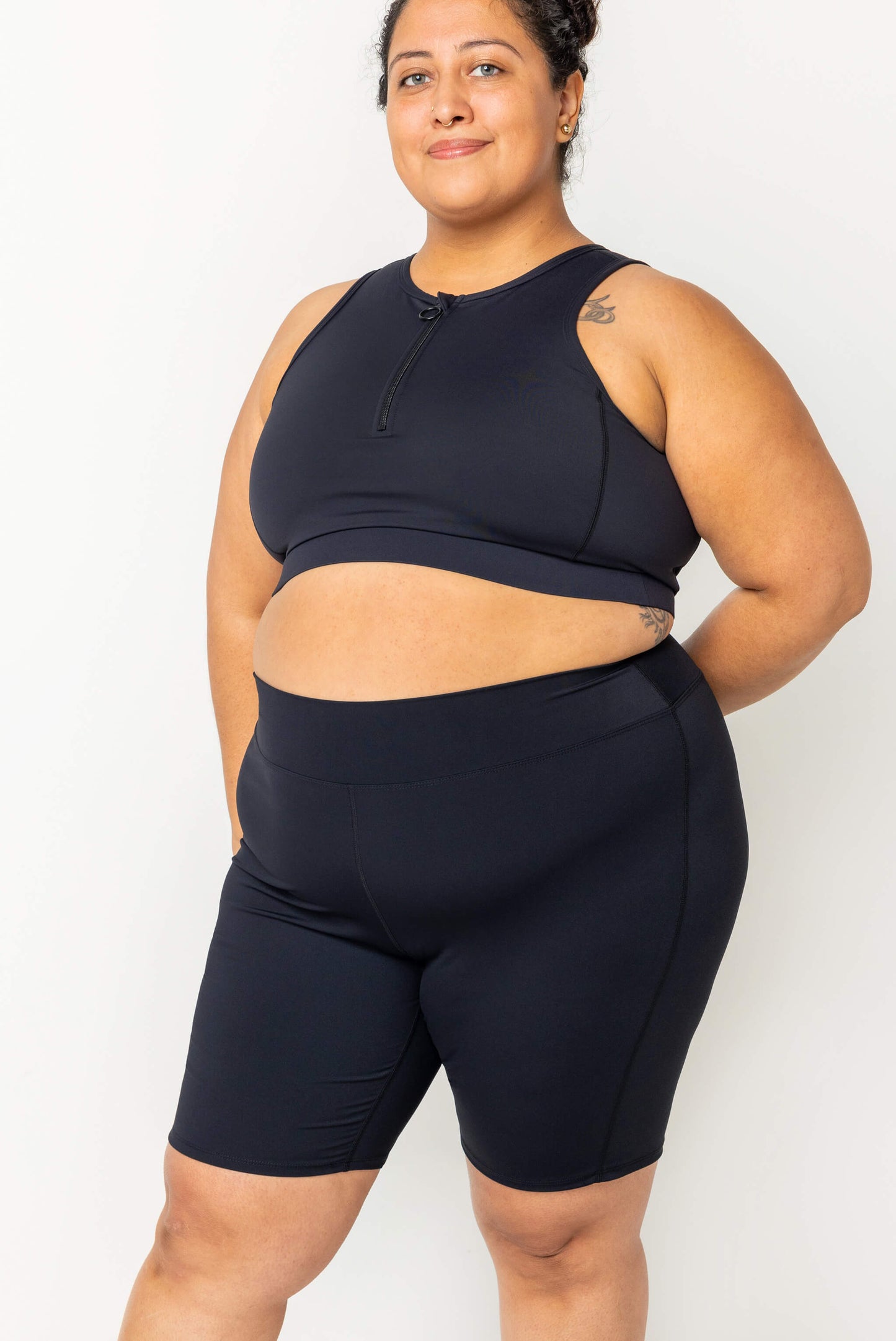 profile view of Plus size model wearing 9 inch swim shorts size 2X