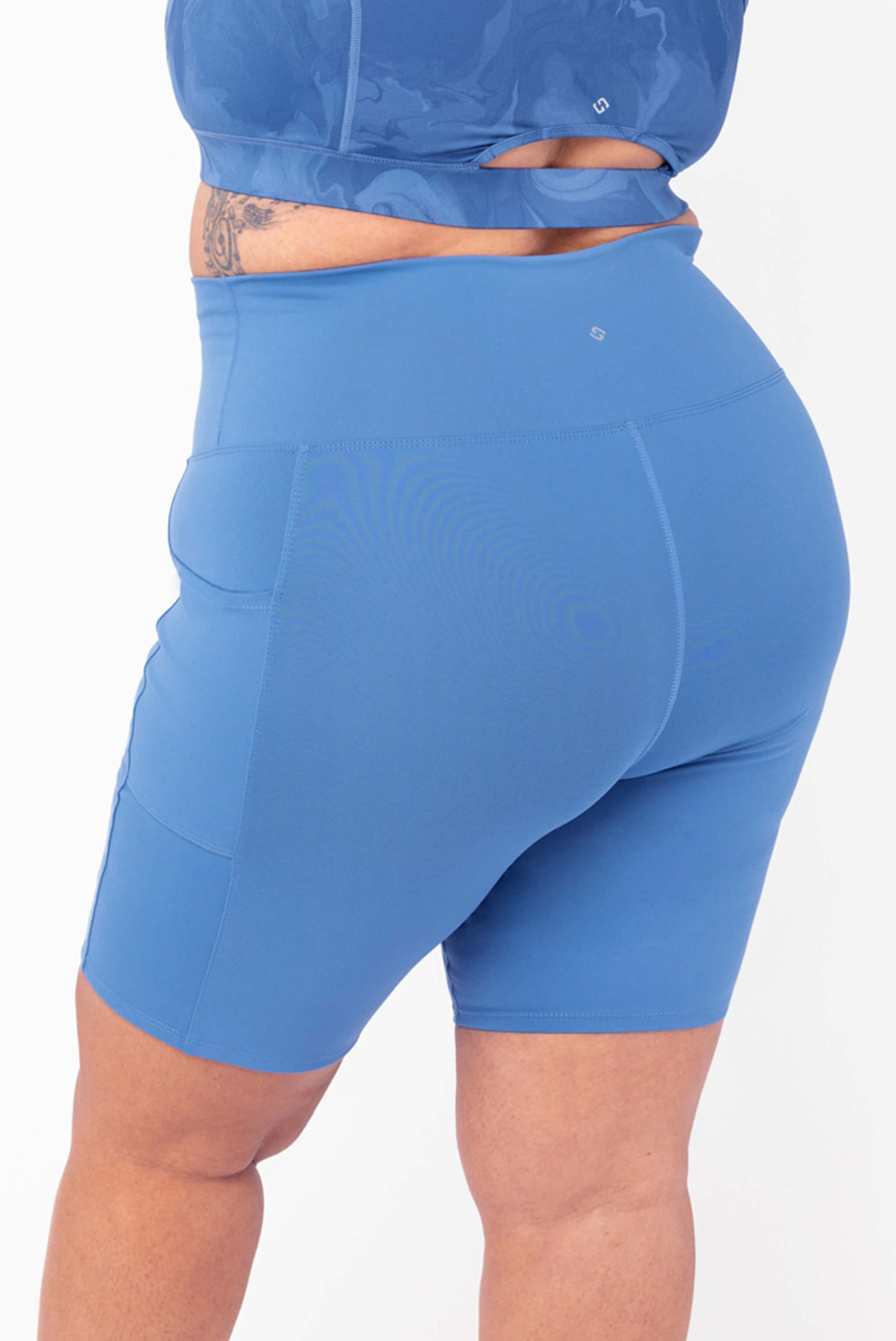 back view of plus size biker shorts with pockets moonlight blue