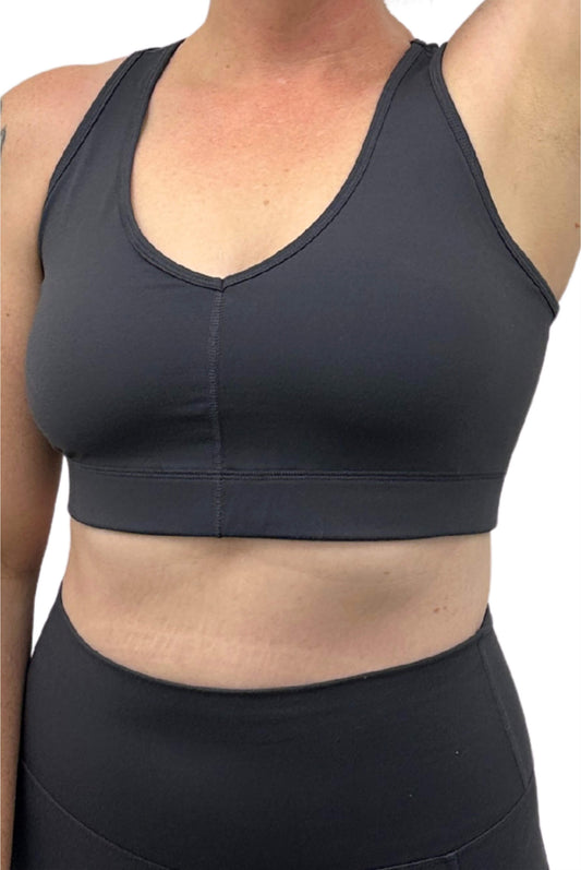 Closeup view of Superfit Hero V-neck Sports Bra Carbon color, underarm view