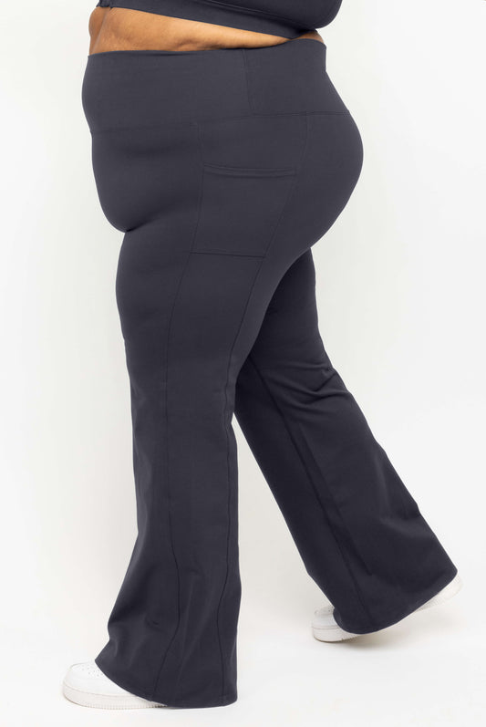 Profile view of Superfit Hero SuperHold™ Flare Leggings with pockets in size 3X
