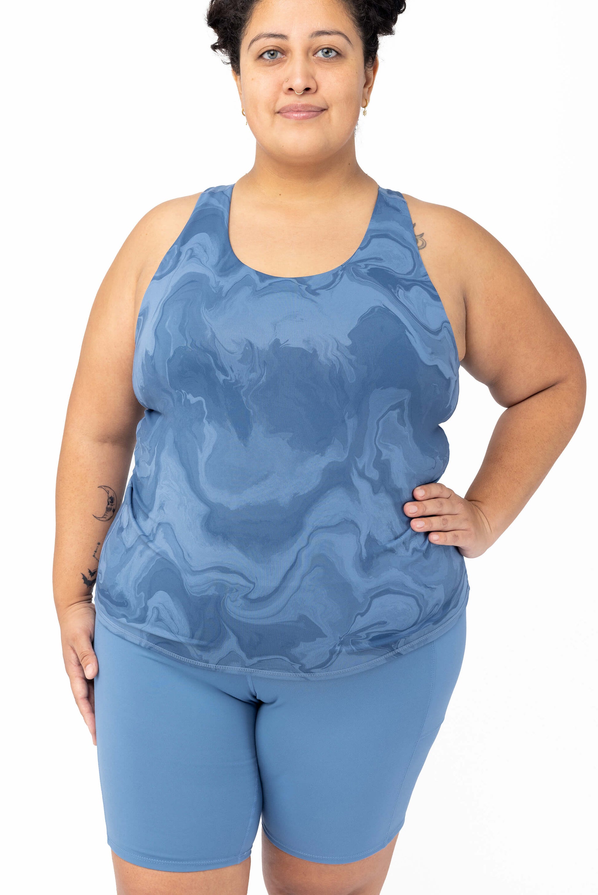 front view of size 2x model wearing plus size tank with built in shelf bra