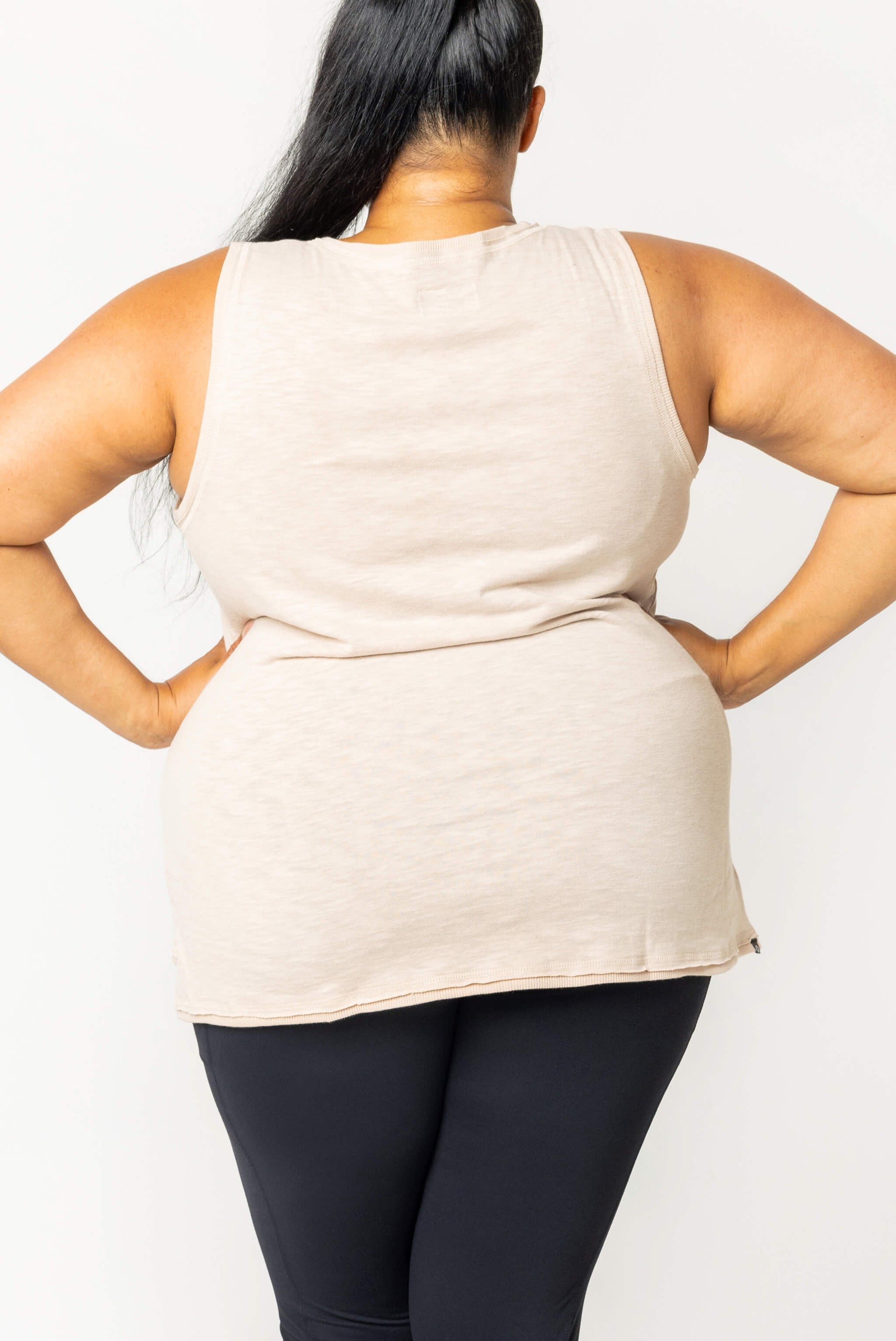 Back view of Plus size model wearing textured muscle tank in size 2X