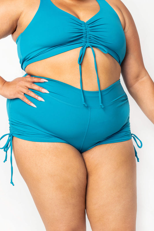 Plus size Teal booty swim shorts with cinched sides tied with bows