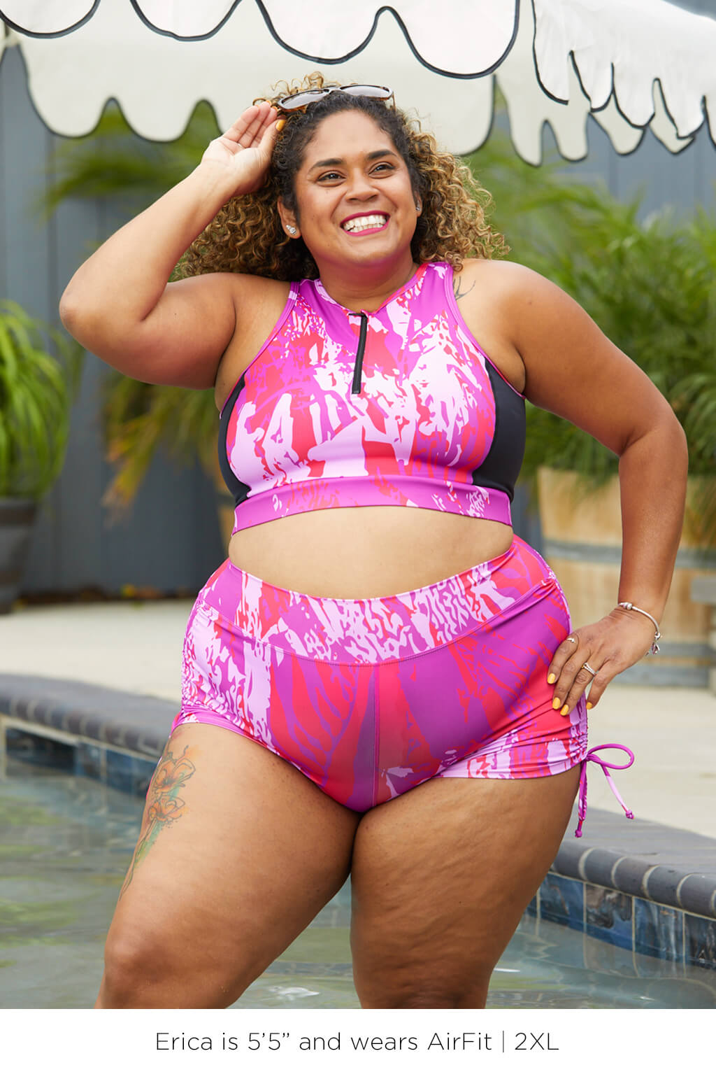 Plus size woman wearing Swim Booty Shorts Fuchsia Sunset in size 2XL by Superfit Hero.