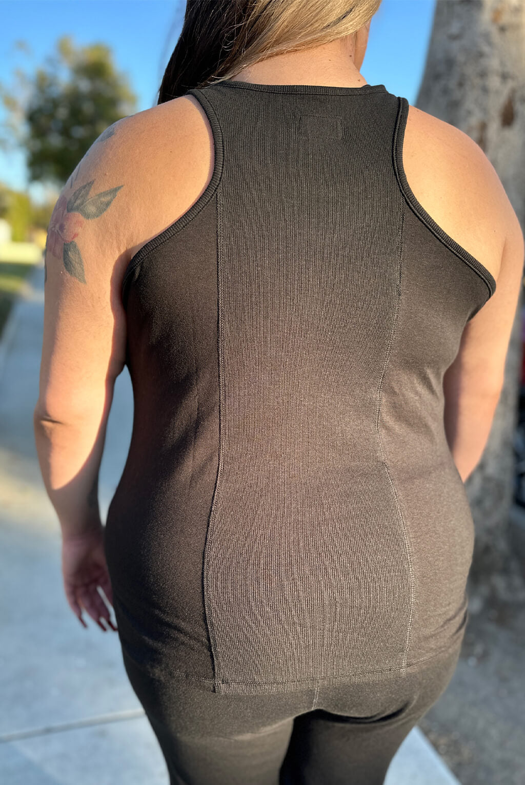 Back view of the Superfit Hero's new launch Ribbed Back Flow Tank Top in color Black.