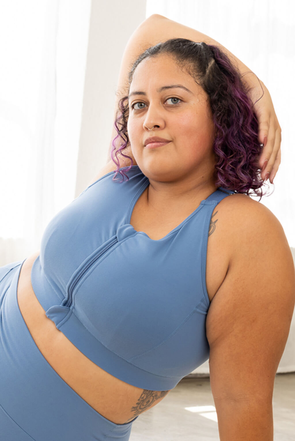 plus size sports bra with a zipper closing front in moonlight blue